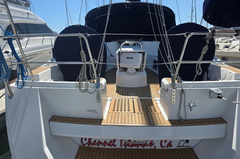 Slide: The Image of 2007 Jeanneau 49 Performance sailboat with teak deck, docked at a marina. - 9