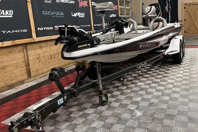 Slide: The Image of 2016 Bass Cat Pantera II boat on trailer in showroom setting. - 9