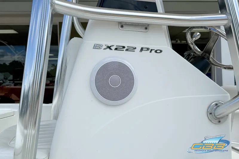 Slide: The Image of 2014 Sea Hunt BX 22 Pro boat console with speaker and steering wheel. - 12