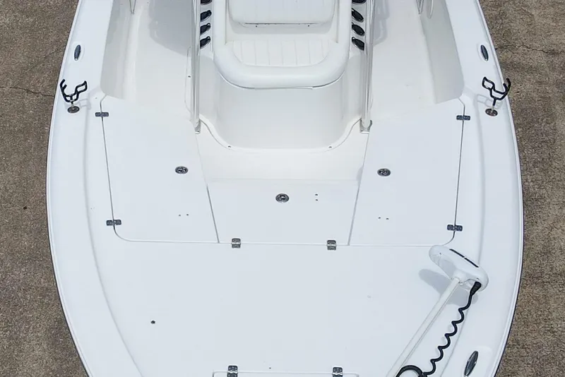 Slide: The Image of 2014 Sea Hunt BX 22 Pro boat deck, featuring seating and storage compartments. - 14