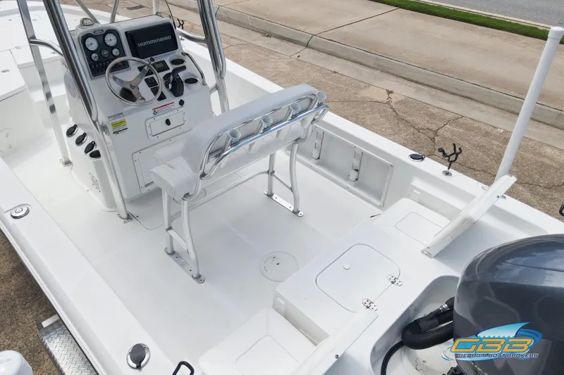 Slide: The Image of 2014 Sea Hunt BX 22 Pro boat interior with steering console and seating. - 16