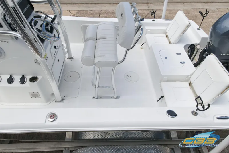 Slide: The Image of 2014 Sea Hunt BX 22 Pro boat interior with seating and steering console. - 17
