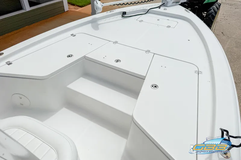 Slide: The Image of 2014 Sea Hunt BX 22 Pro boat deck with storage compartments and seating. - 19