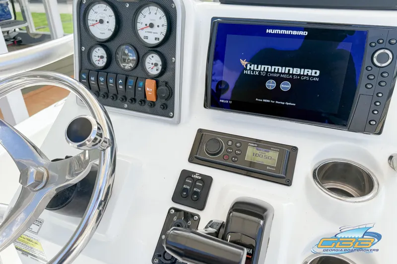 Slide: The Image of Control panel of 2014 Sea Hunt BX 22 Pro with Humminbird GPS and gauges. - 22