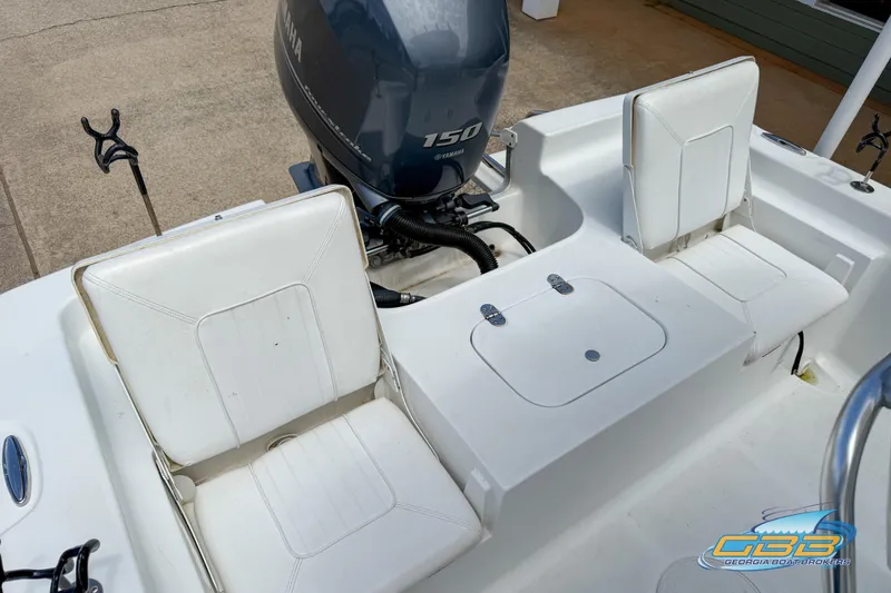 Slide: The Image of 2014 Sea Hunt BX 22 Pro boat with Yamaha 150 engine and white seating. - 24