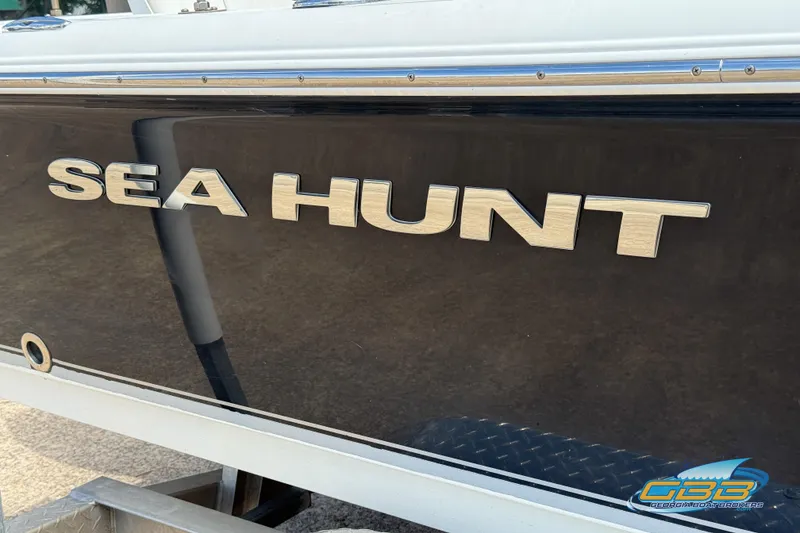 Slide: The Image of 2014 Sea Hunt BX 22 Pro boat with logo on the side. - 31