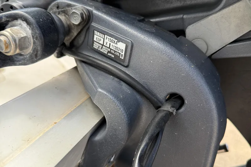 Slide: The Image of Close-up of Yamaha F150XA engine part on 2014 Sea Hunt BX 22 Pro boat. - 33