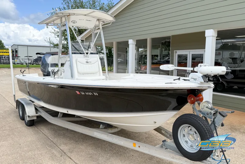 Slide: The Image of 2014 Sea Hunt BX 22 Pro boat on trailer, parked outside a building. - 5