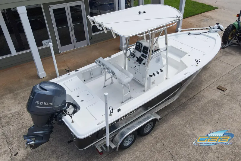 Slide: The Image of 2014 Sea Hunt BX 22 Pro boat on trailer, featuring Yamaha outboard motor. - 7