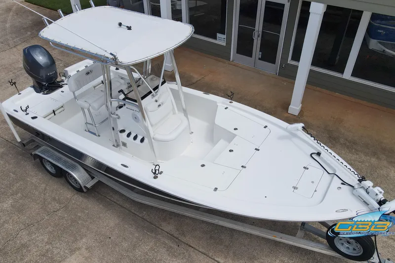 Slide: The Image of 2014 Sea Hunt BX 22 Pro boat on trailer, viewed from above, near a building. - 8