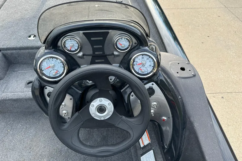 Slide: The Image of Steering console of 2024 Tracker Pro Team 190 TX boat with gauges and controls. - 5