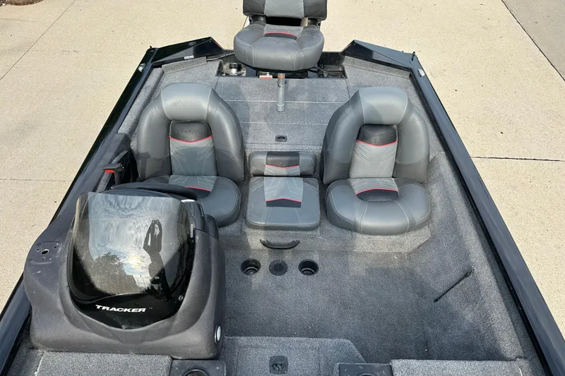 Slide: The Image of 2024 Tracker Pro Team 190 TX boat interior with gray seating and console. - 6