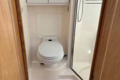 Slide: The Image of Tiara Yachts 4100 Open 2000 model bathroom with toilet and shower. - 14