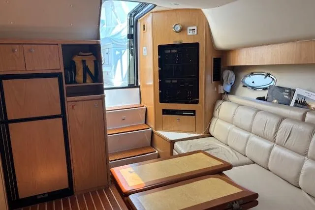 Slide: The Image of 2000 Tiara Yachts 4100 Open kitchen with wooden cabinets and modern appliances. - 3