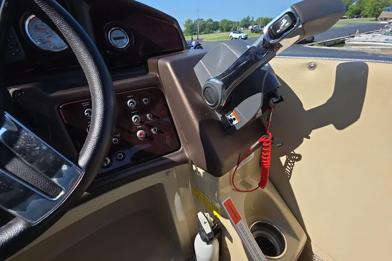 Slide: The Image of Dashboard and controls of a 2015 Crest III 230 SL boat. - 11