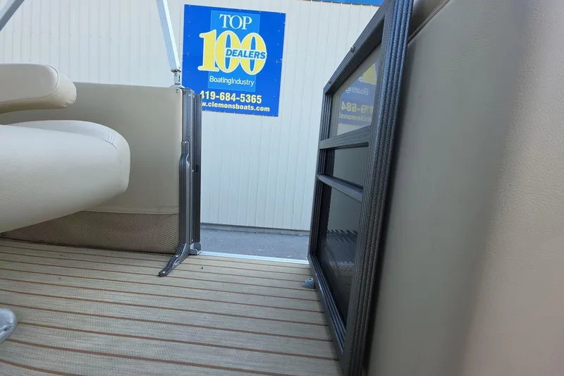 Slide: The Image of Interior view of a 2015 Crest III 230 SL boat with seating and flooring details. - 17