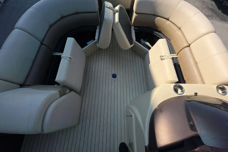 Slide: The Image of 2015 Crest III 230 SL boat interior with beige seating and wood-style flooring. - 19