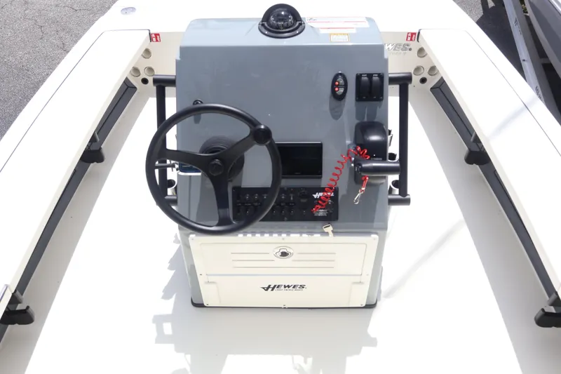 Slide: The Image of 2026 Hewes Redfisher 18 boat interior with steering console and seating. - 3