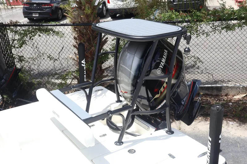 Slide: The Image of 2026 Hewes Redfisher 18 boat console with steering wheel and rod holders. - 5