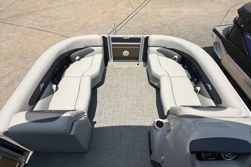 Slide: The Image of 2025 Barletta Aria 20L pontoon boat interior with plush seating and modern design. - 4