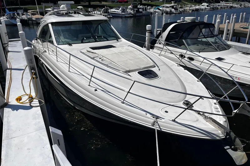The Image of 2012 Sea Ray 500 Sundancer yacht docked at marina, side view. - 1