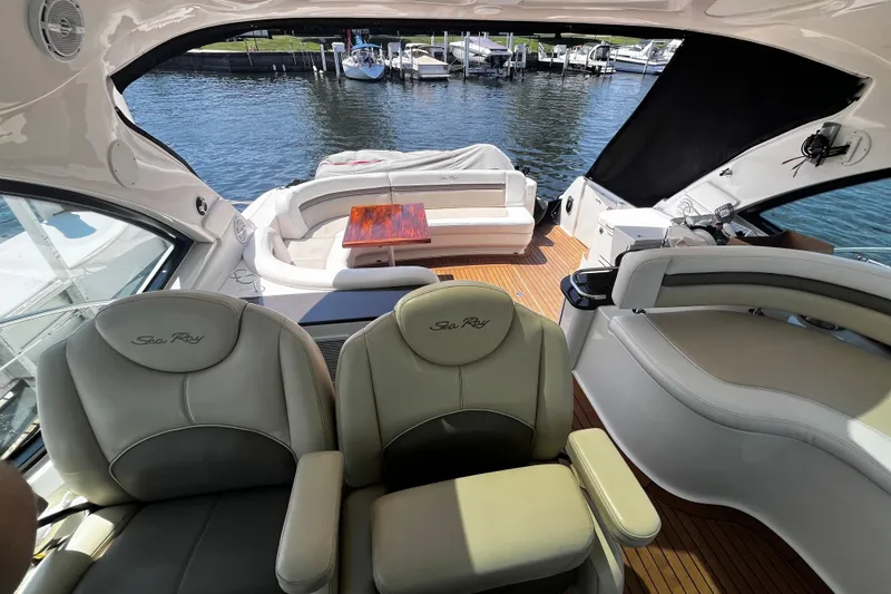 Slide: The Image of Luxurious 2012 Sea Ray 500 Sundancer yacht interior with plush seating and waterfront view. - 14