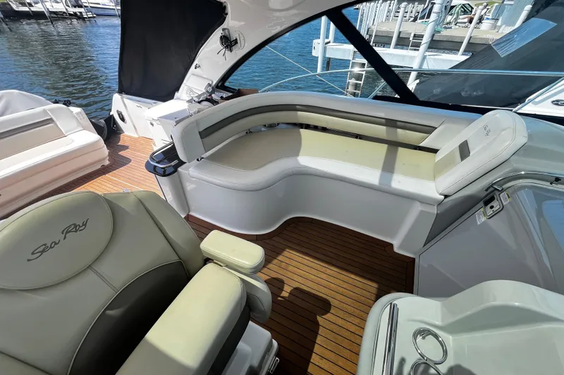 Slide: The Image of Luxurious 2012 Sea Ray 500 Sundancer yacht interior with elegant seating and wood flooring. - 15