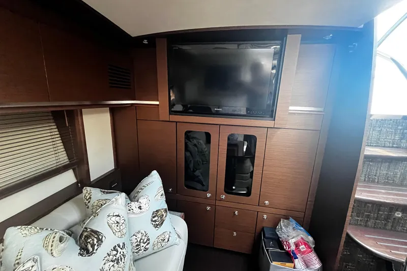 Slide: The Image of Luxurious interior of 2012 Sea Ray 500 Sundancer yacht with TV and stylish decor. - 20