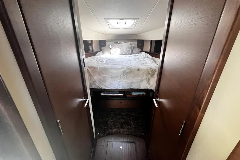 Slide: The Image of Luxurious cabin interior of 2012 Sea Ray 500 Sundancer yacht with cozy bed. - 24