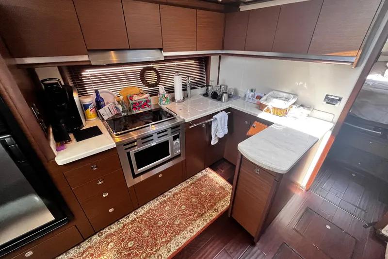 Slide: The Image of Luxurious kitchen interior of 2012 Sea Ray 500 Sundancer yacht with modern appliances. - 35