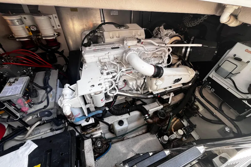 Slide: The Image of Engine room of a 2012 Sea Ray 500 Sundancer yacht, showcasing detailed machinery. - 38