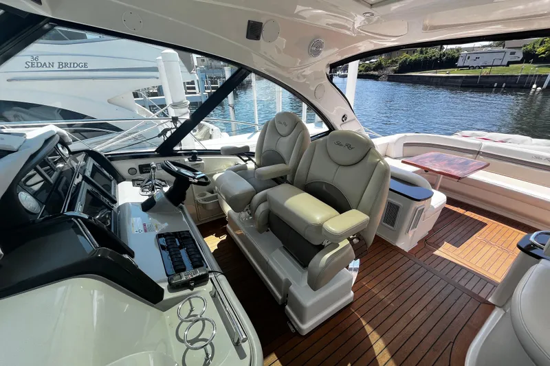 Slide: The Image of Luxurious 2012 Sea Ray 500 Sundancer yacht interior with helm and seating area. - 7