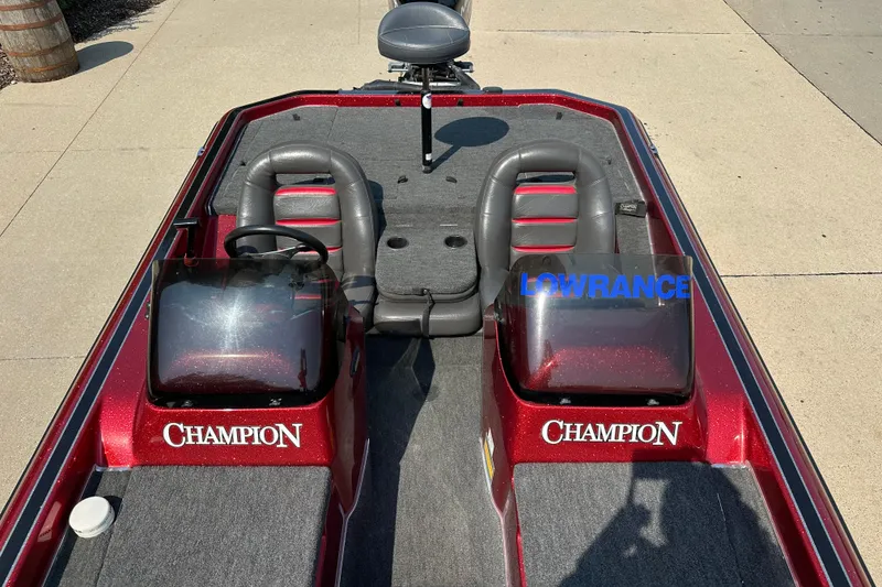 Slide: The Image of 1999 Champion 193 DCX boat interior with dual seats and Lowrance equipment. - 9