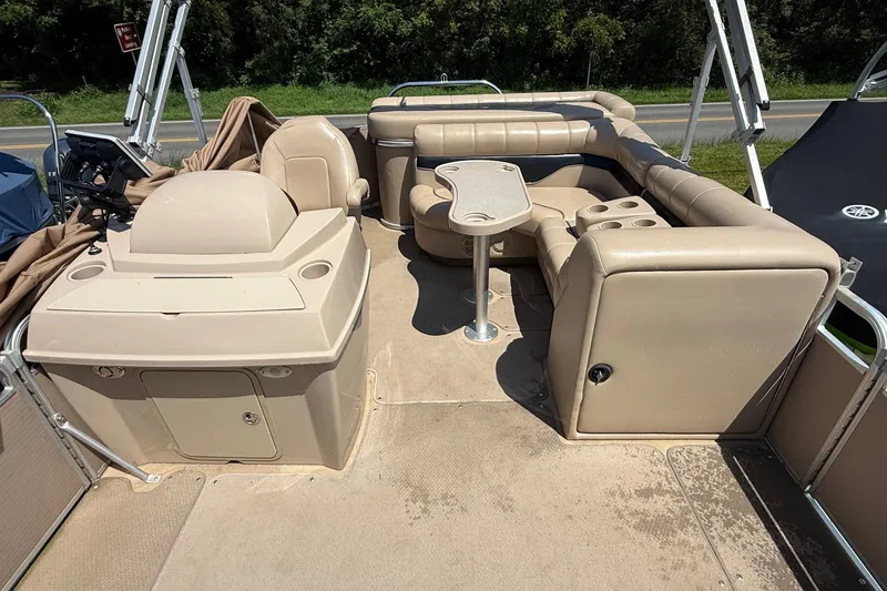 Slide: The Image of 2004 Parti Kraft Admiral 220 RE pontoon boat interior with seating and helm station. - 12
