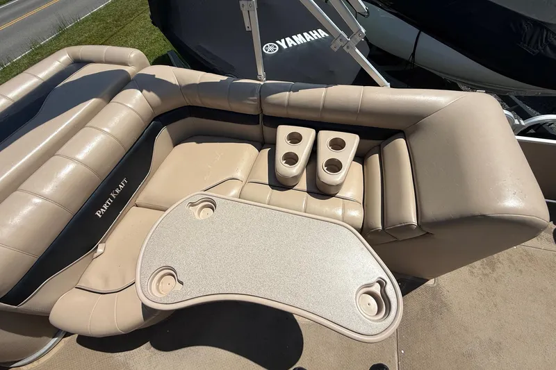 Slide: The Image of Luxurious seating on 2004 Parti Kraft Admiral 220 RE pontoon boat with cup holders and table. - 14