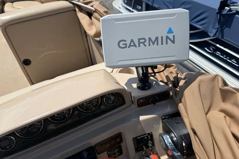 Slide: The Image of 2004 Parti Kraft Admiral 220 RE boat dashboard with Garmin navigation system. - 27