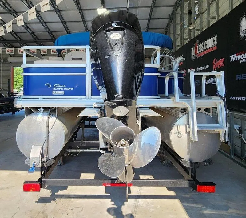 Slide: The Image of 2017 Sun Tracker FISHIN' BARGE® 24 DLX pontoon boat in a garage. - 3