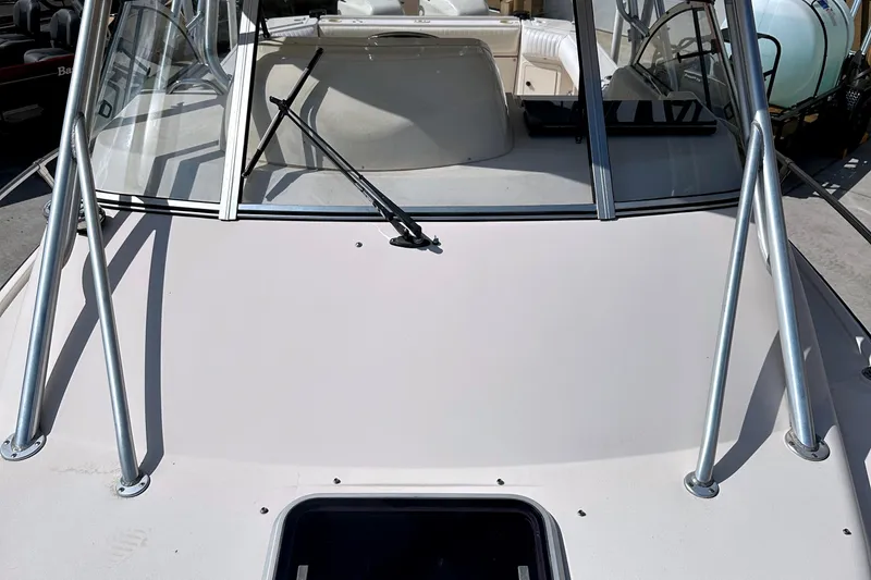 Slide: The Image of 2000 Grady-White Express 265 boat deck with windshield and metal supports. - 10