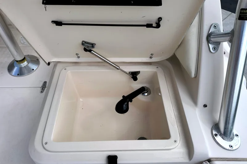 Slide: The Image of Open storage compartment on a 2000 Grady-White Express 265 boat. - 23