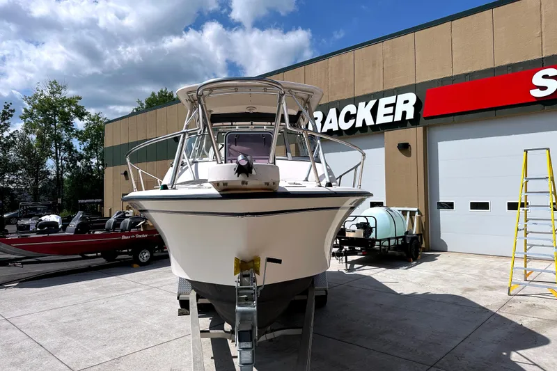Slide: The Image of 2000 Grady-White Express 265 boat displayed outside a Tracker store. - 3