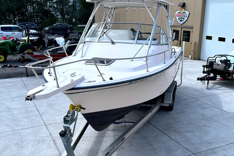 Slide: The Image of 2000 Grady-White Express 265 boat on trailer in outdoor setting. - 9