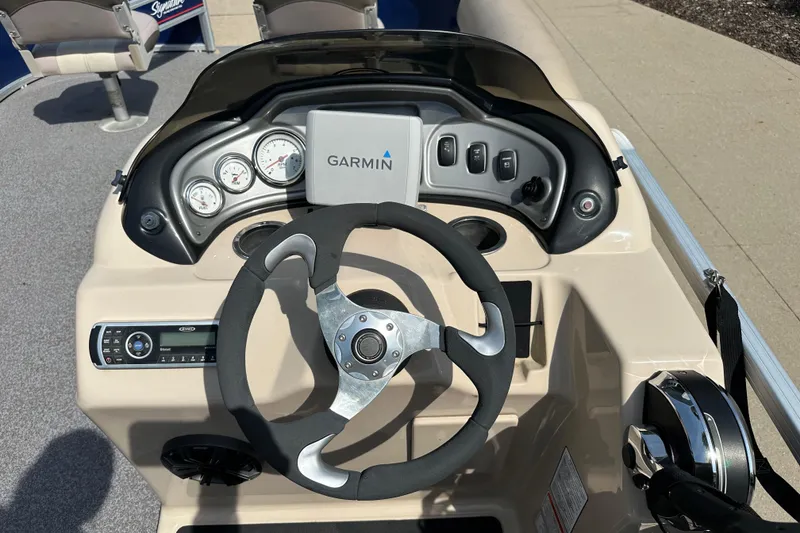 Slide: The Image of Steering console of 2015 Sun Tracker Fishin' Barge 20 DLX with Garmin navigation system. - 3
