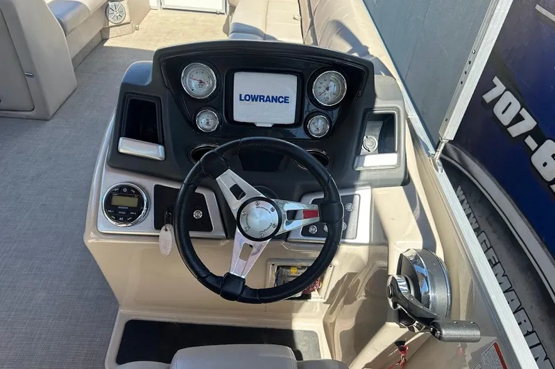 Slide: The Image of Steering console of 2017 Ranger Reata 220C boat with Lowrance display and gauges. - 18