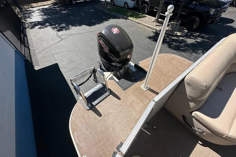 Slide: The Image of 2017 Ranger Reata 220C boat with motor and ladder on deck. - 24