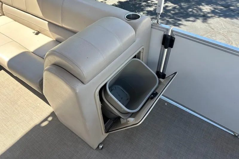 Slide: The Image of 2017 Ranger Reata 220C boat seat with built-in storage compartment and trash bin. - 26