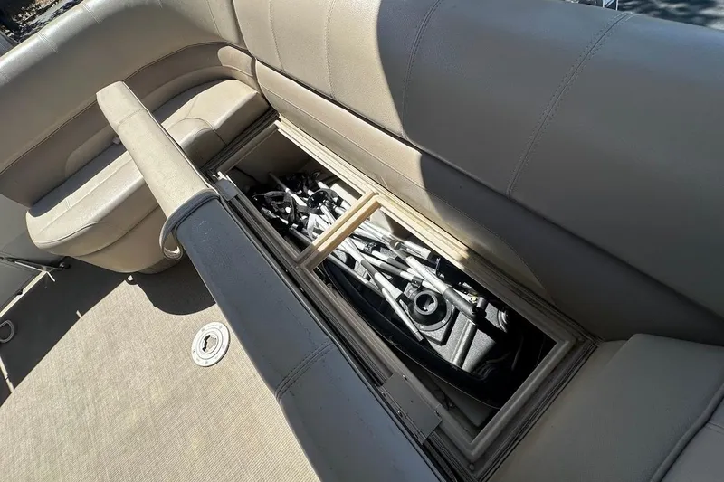 Slide: The Image of 2017 Ranger Reata 220C boat storage compartment with equipment inside. - 31