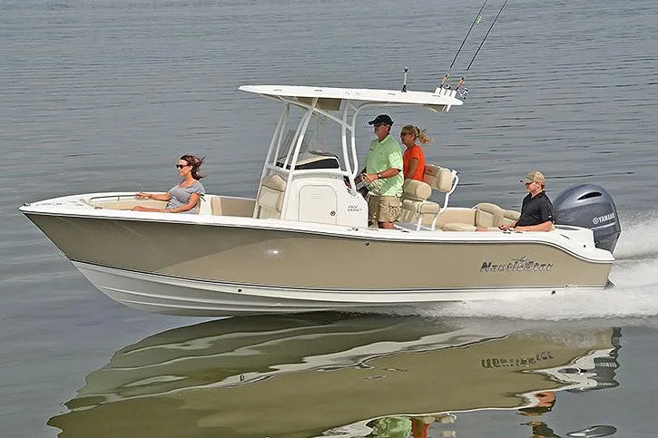 Slide: The Image of Manufacturer Provided Image: 2017 NauticStar 2302 Legacy boat cruising with passengers on calm water. - 15