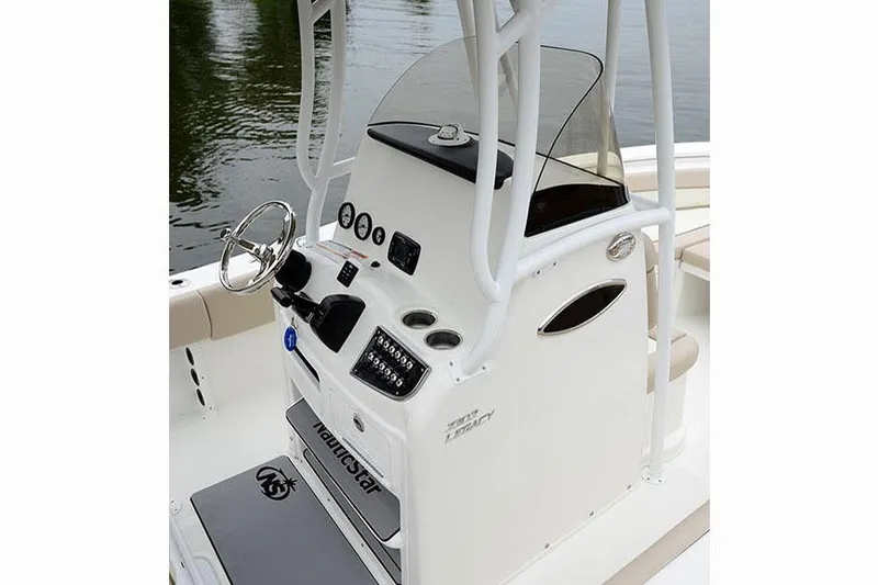 Slide: The Image of Manufacturer Provided Image: 2017 NauticStar 2302 Legacy boat console with steering wheel and controls. - 17
