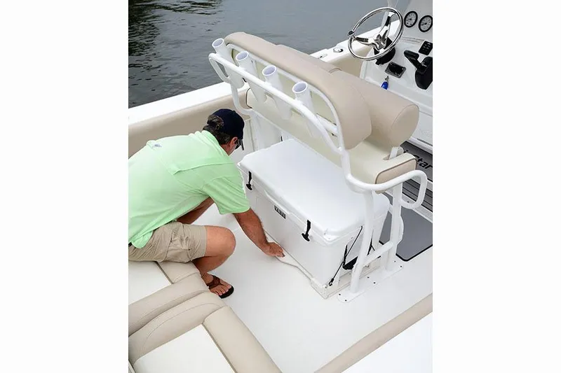 Slide: The Image of Manufacturer Provided Image: Man accessing cooler on 2017 NauticStar 2302 Legacy boat. - 18
