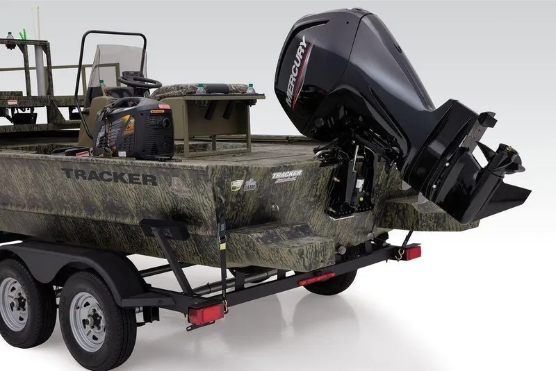 Slide: The Image of 2026 Tracker GRIZZLY® 2072 CC Sportsman boat with Mercury outboard motor on trailer. - 10